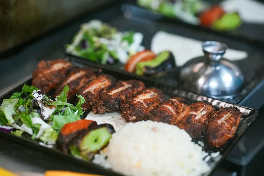 Mixed grill platter with rice and salad