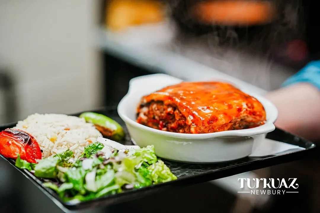 Stuffed pepper with rice and salad on a tray
